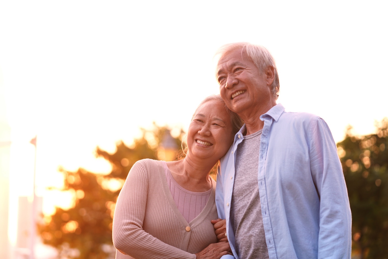 happy senior asian couple relaxing outdoors