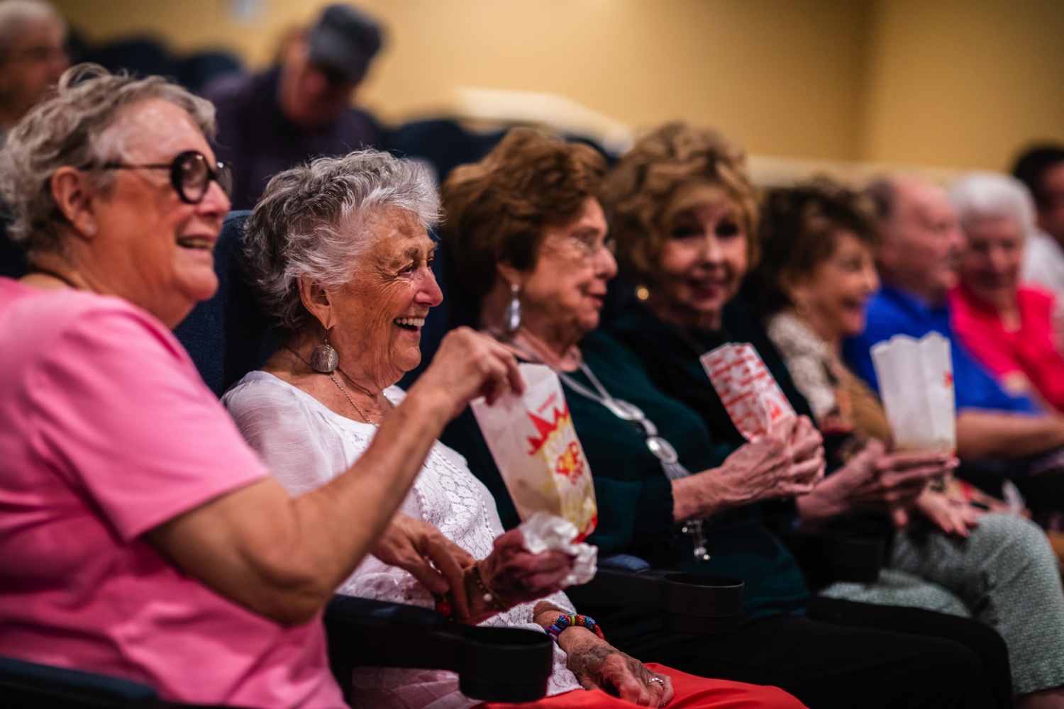 senior living residents watching a movie