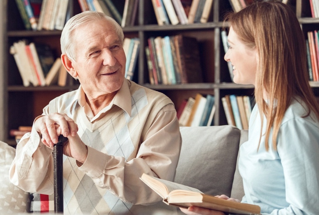 Father and daughter at home library