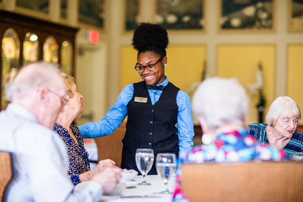 Senior enjoying food at the restaurant with chef