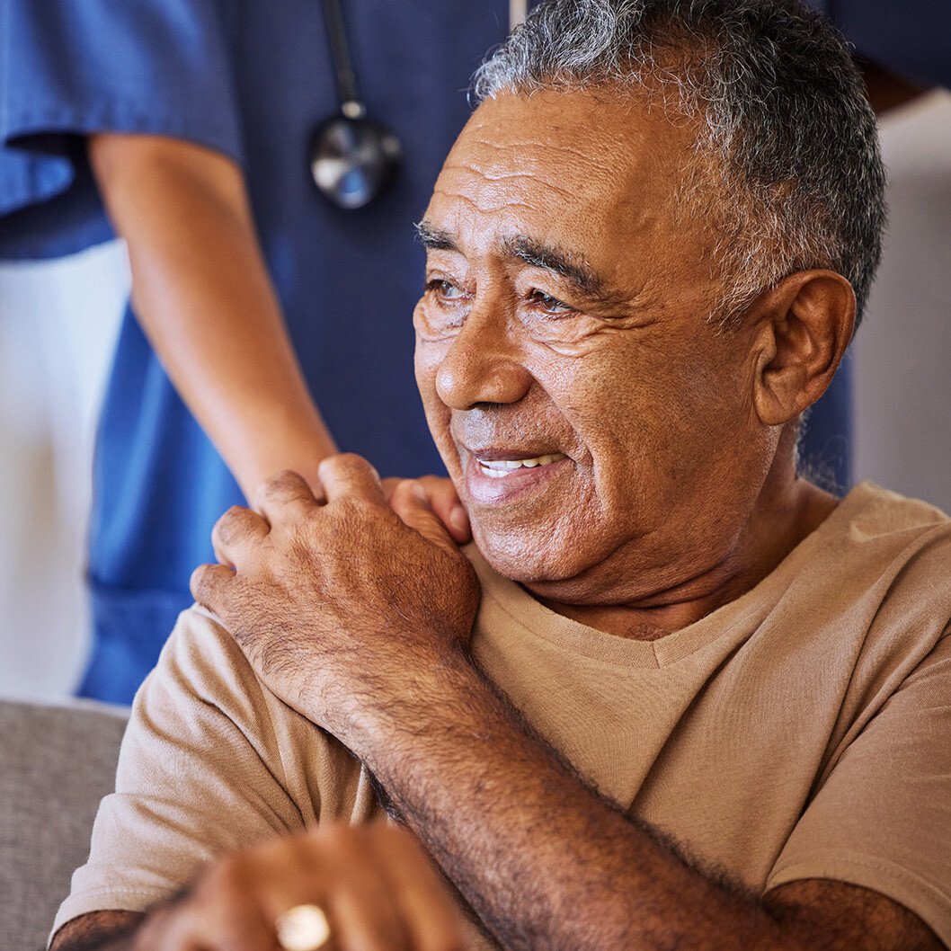 Senior man handing hands with caregiver