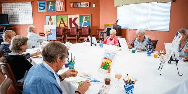 Residents doing crafts in memory care community