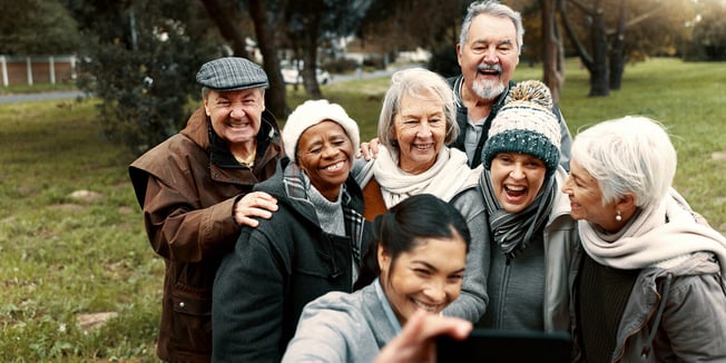 senior friends outdoors taking a selfie