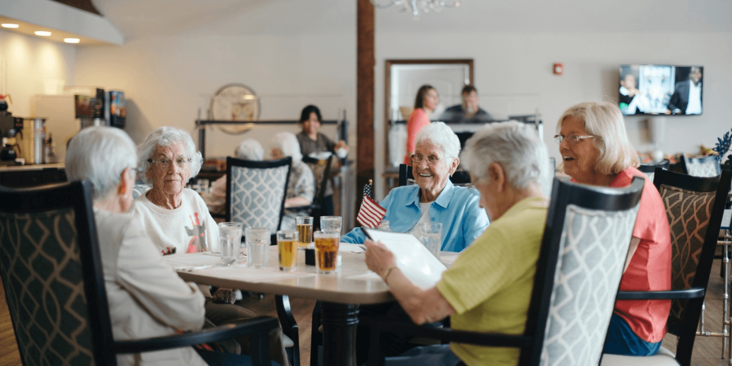 seniors enjoying a meal at a Cedarhurst Senior Living Community