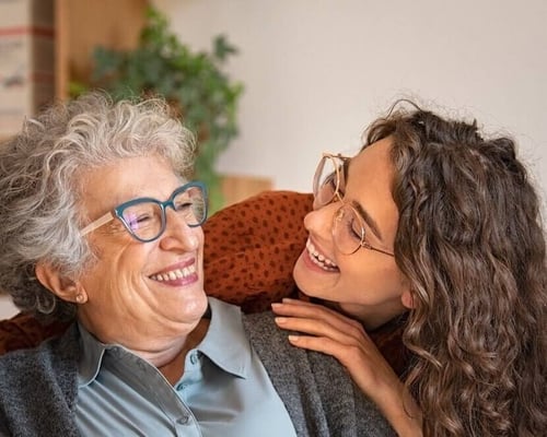 senior woman and caregiver exercising