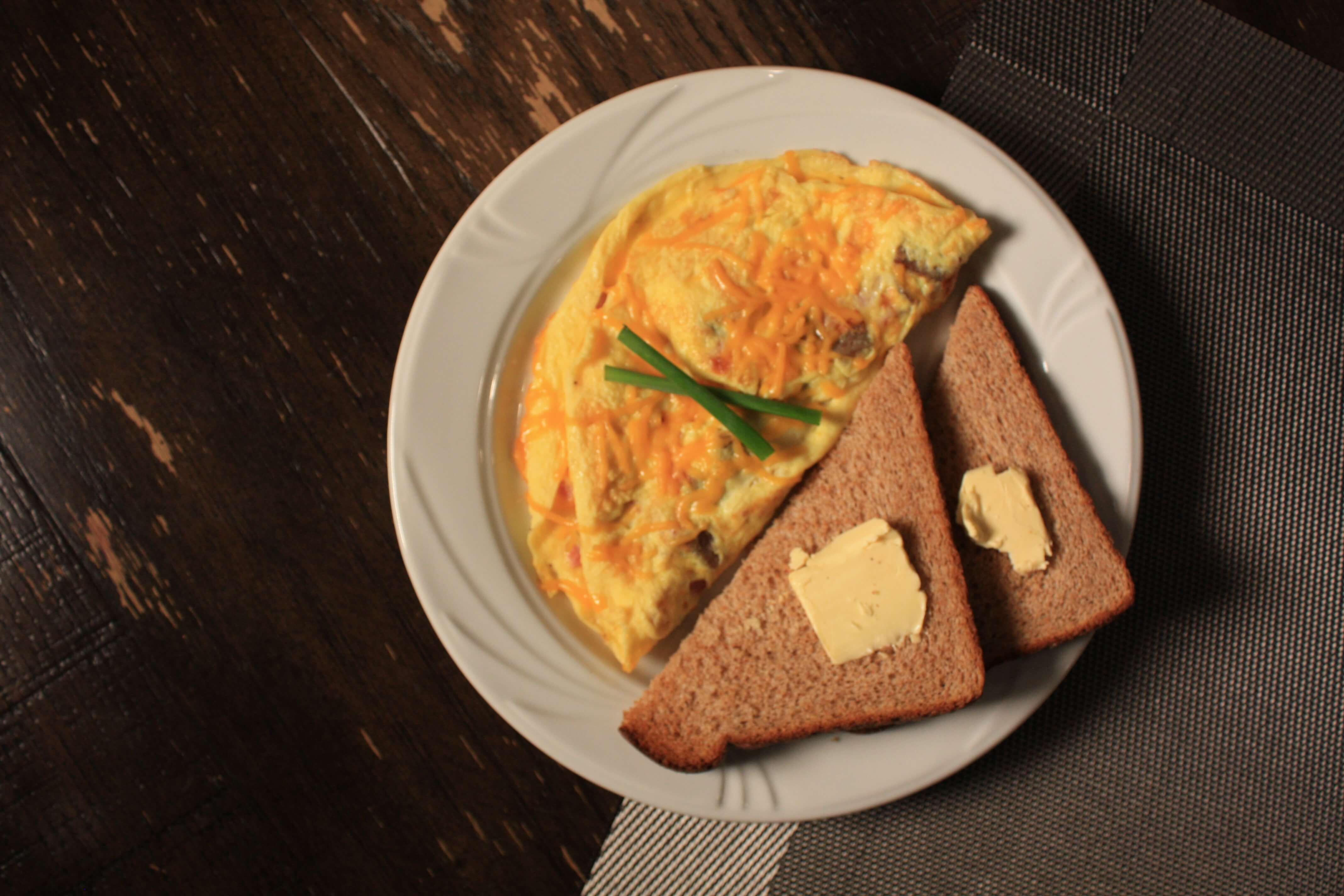 Plate with two pieces of toast and omelet