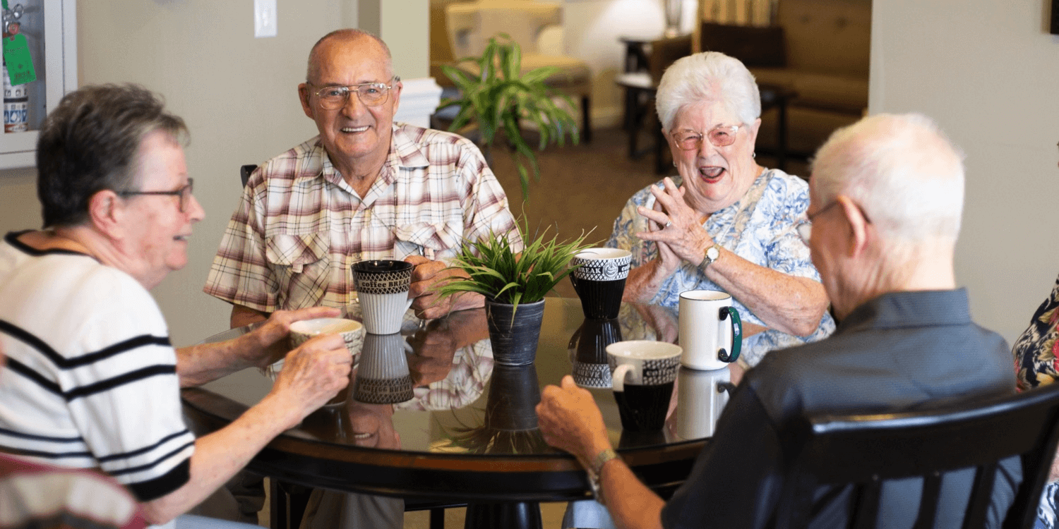 Friends having coffee at a dining table