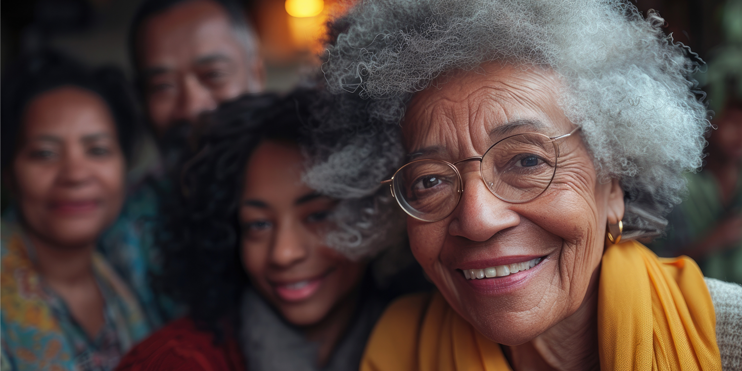 Senior woman with her children and grandchildren in the background